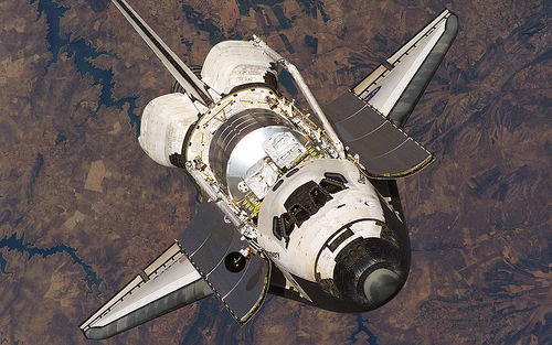 Space Shuttle Discovery approaches ISS for docking [1680x1050]